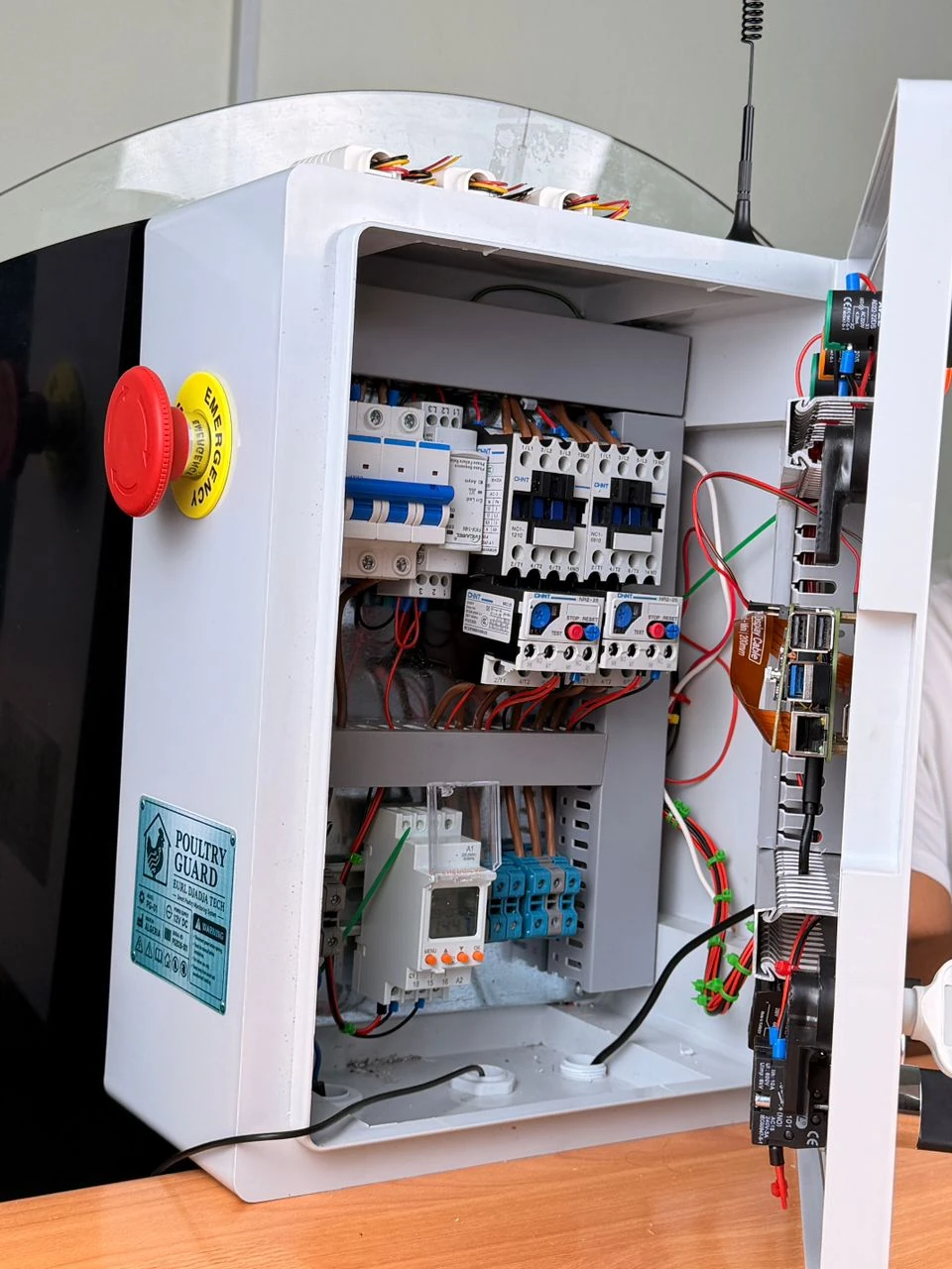 Open cabinet showing protection equipment and embedded computer